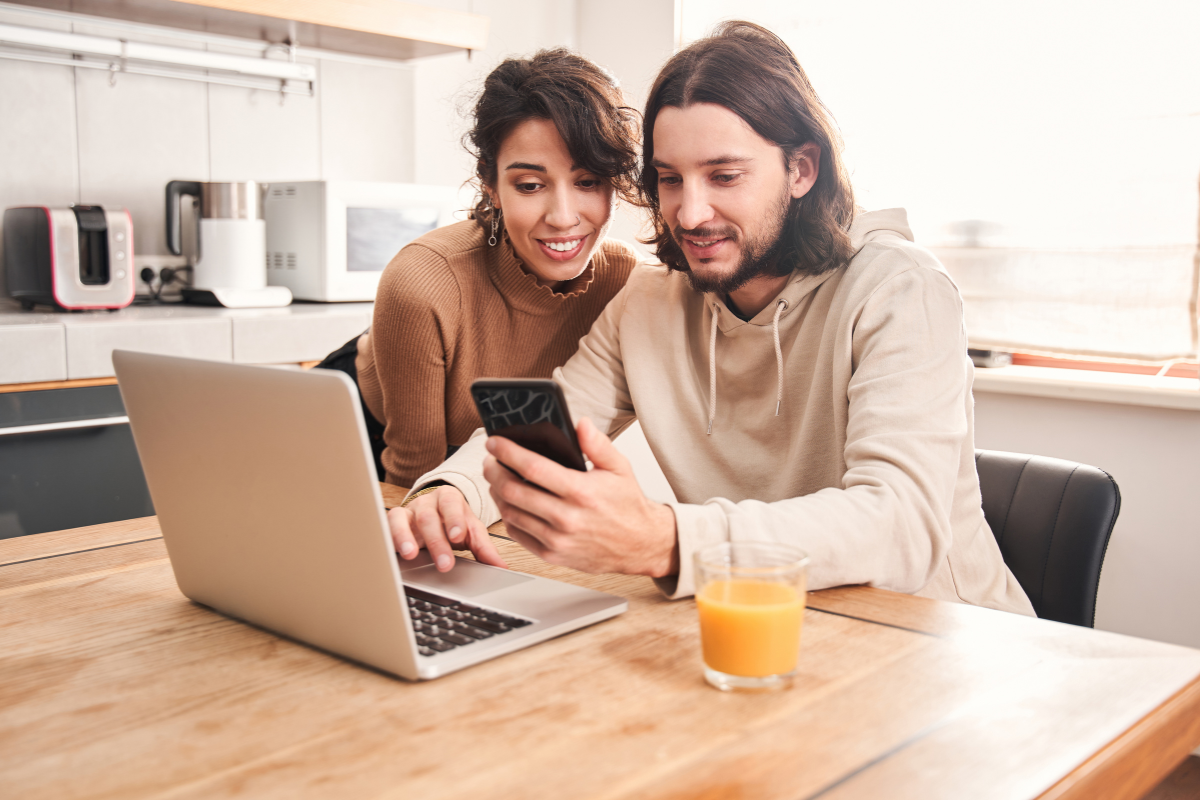 Couple looking at a laptop.